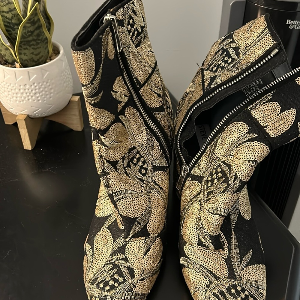 Black and gold boots